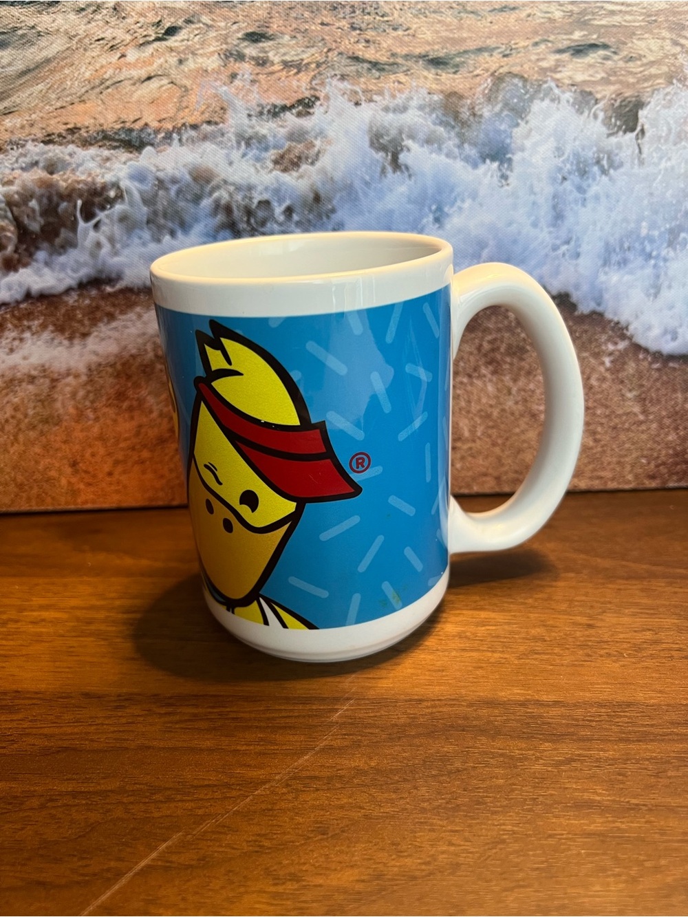 Blue Ceramic Mug with Yellow Fish Character and Red Accent